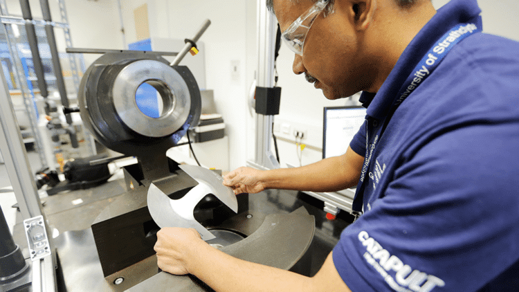 Engineer using manufacturing equipment