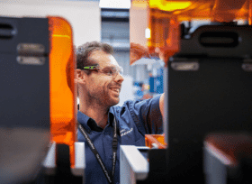 Engineer behind manufacturing equipment