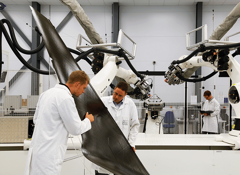 People working at a large manufacturing company