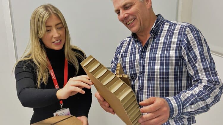 Two people test a manufacturing product