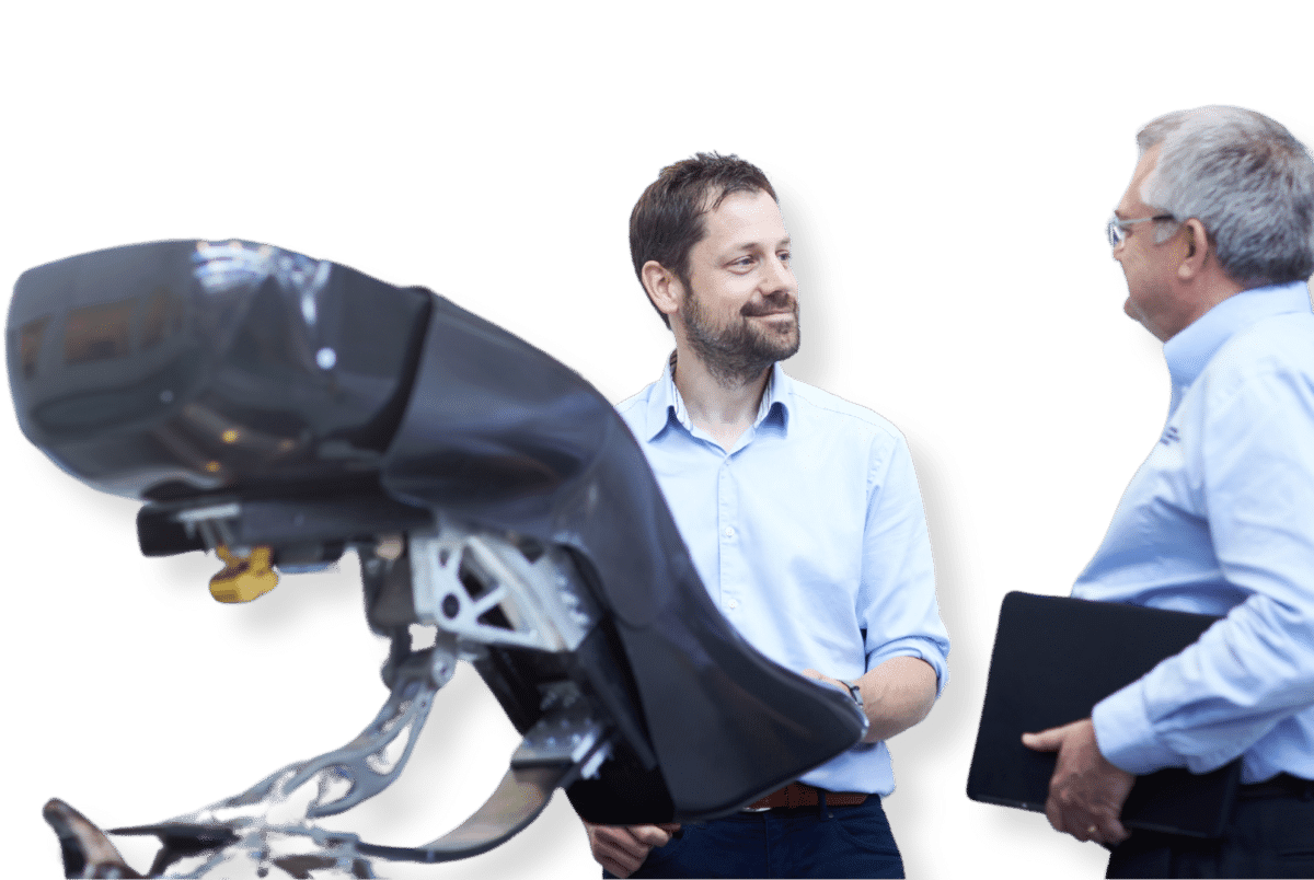Two men in discussion in a research environment.