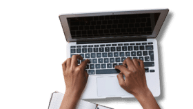 person typing on laptop